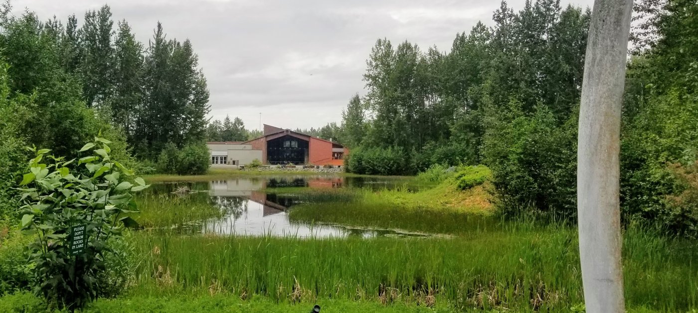 The Alaska Native Heritage Center across Lake Tiulana in Anchorage, Alaska