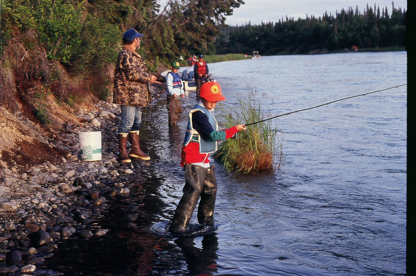 Anglers fishing for red salmon on the Kenai River, Alaska